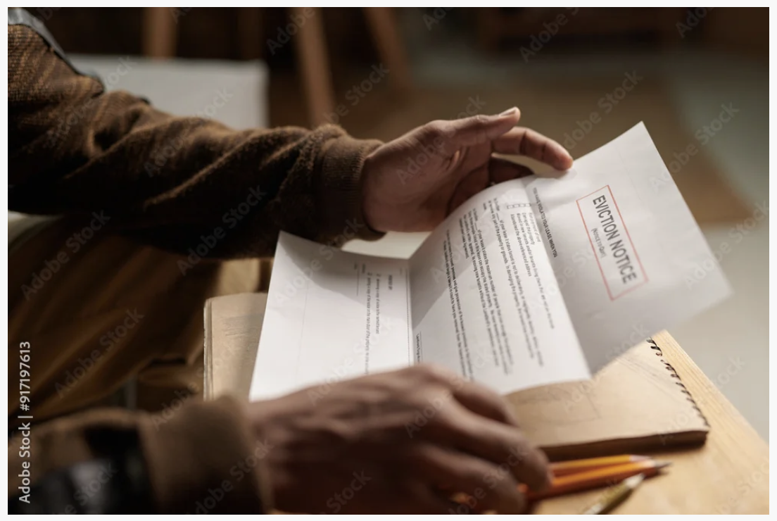 Tenant reading an eviction notice in California