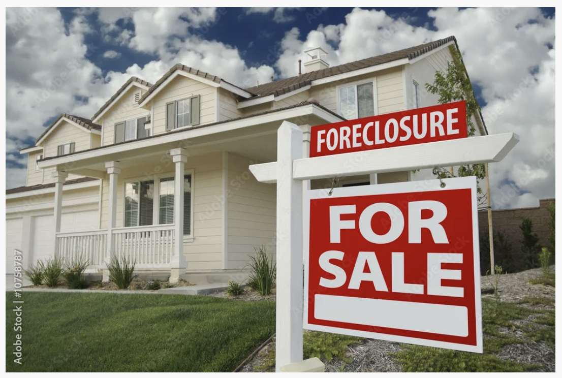 Foreclosure for sale sign in front of a California house